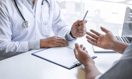 a patient explaining injury to a doctor.