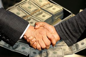 handshake with money