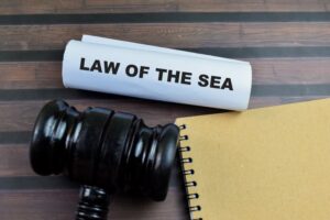 Law of the Sea text on Document and Gavel isolated on office desk.