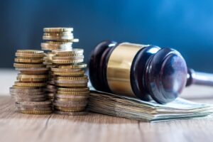 gavel with euro banknotes and coin.