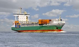 A container ship navigating through the open sea.