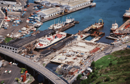 aerial view of harbor with barges and other vessels