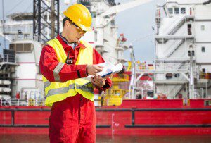 Dock worker with yellow hard hat