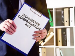 A written note displays the text "Workmen's Compensation Act."