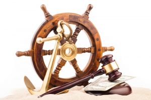 gavel with money and ship anchor