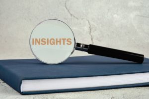 magnifying glass hovering over the word 'insights'