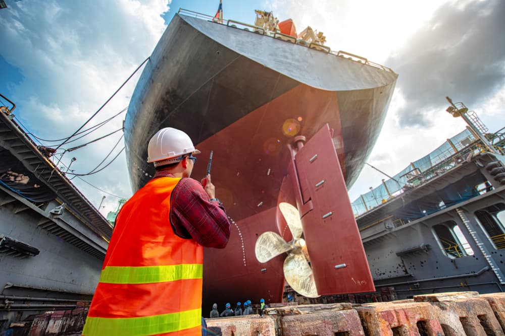 A port controller and harbor master overseeing terminal operations to ensure safety and security during a ship's stay in port.
