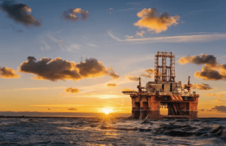 Oil rig vessel at sunset
